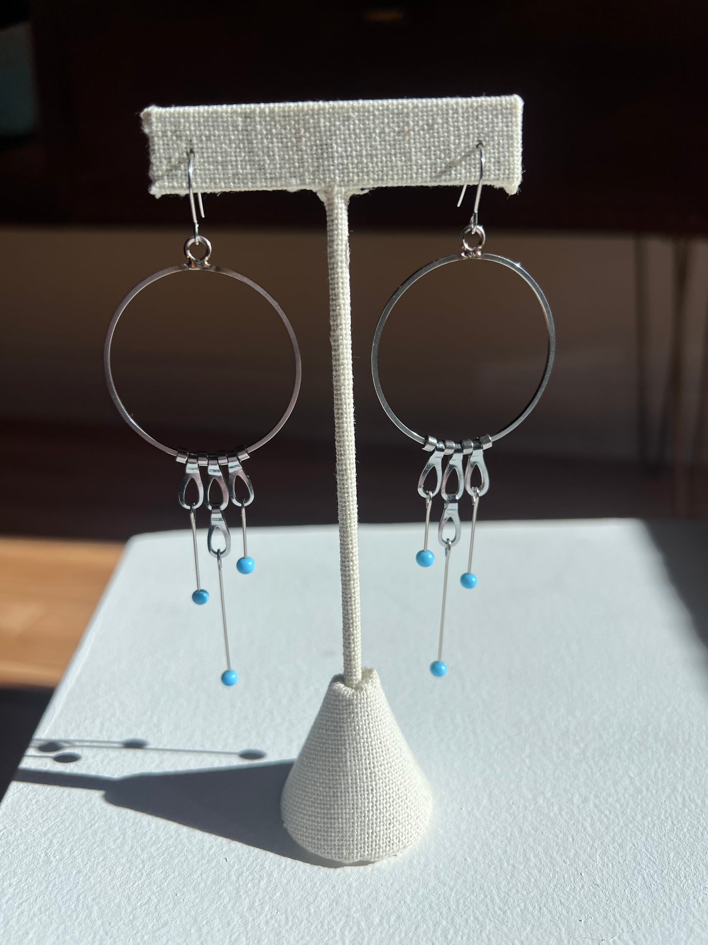 Circle Earrings with Chain and Blue Tipped Pins